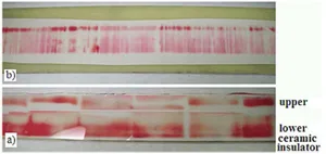 Fig. 2. High Pressurex® film between the (a) upper G-10 insulator and steel containment and (b) primary and augmenting rails.